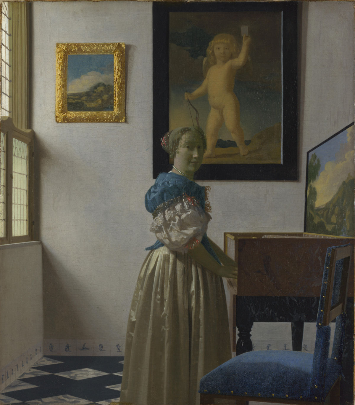 Pintura restaurada de Vermeer revela uma obra de Cupido oculta pendurada no fundo