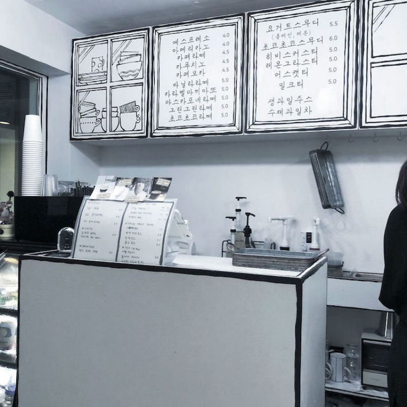 Um caf em Seul usa linhas de contorno inteligentes para parecer um desenho bidimensional 12