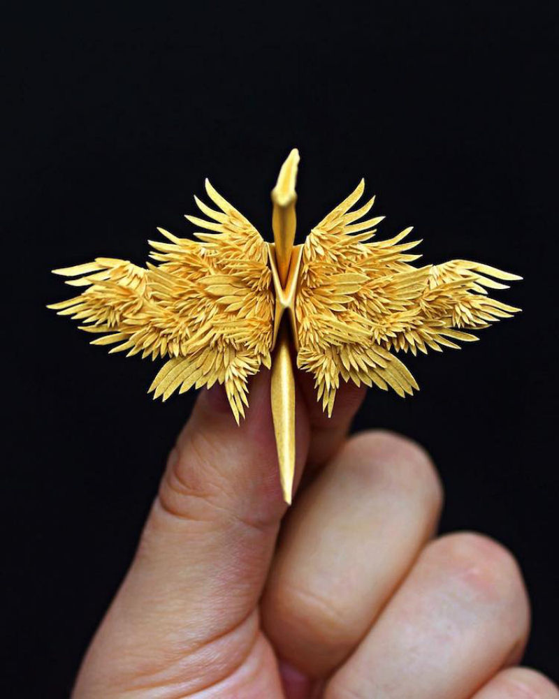 Este artista cria elegantes garas de papel compostos por intrivados cortes dobras e flores 13