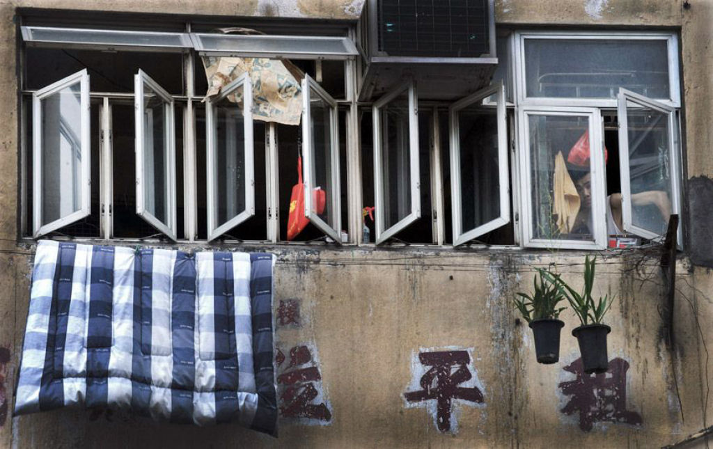 A vida nas celas de co em Hong Kong 13