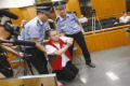 Uma mãe chinesa salva o assassino de seu filho do corredor da morte